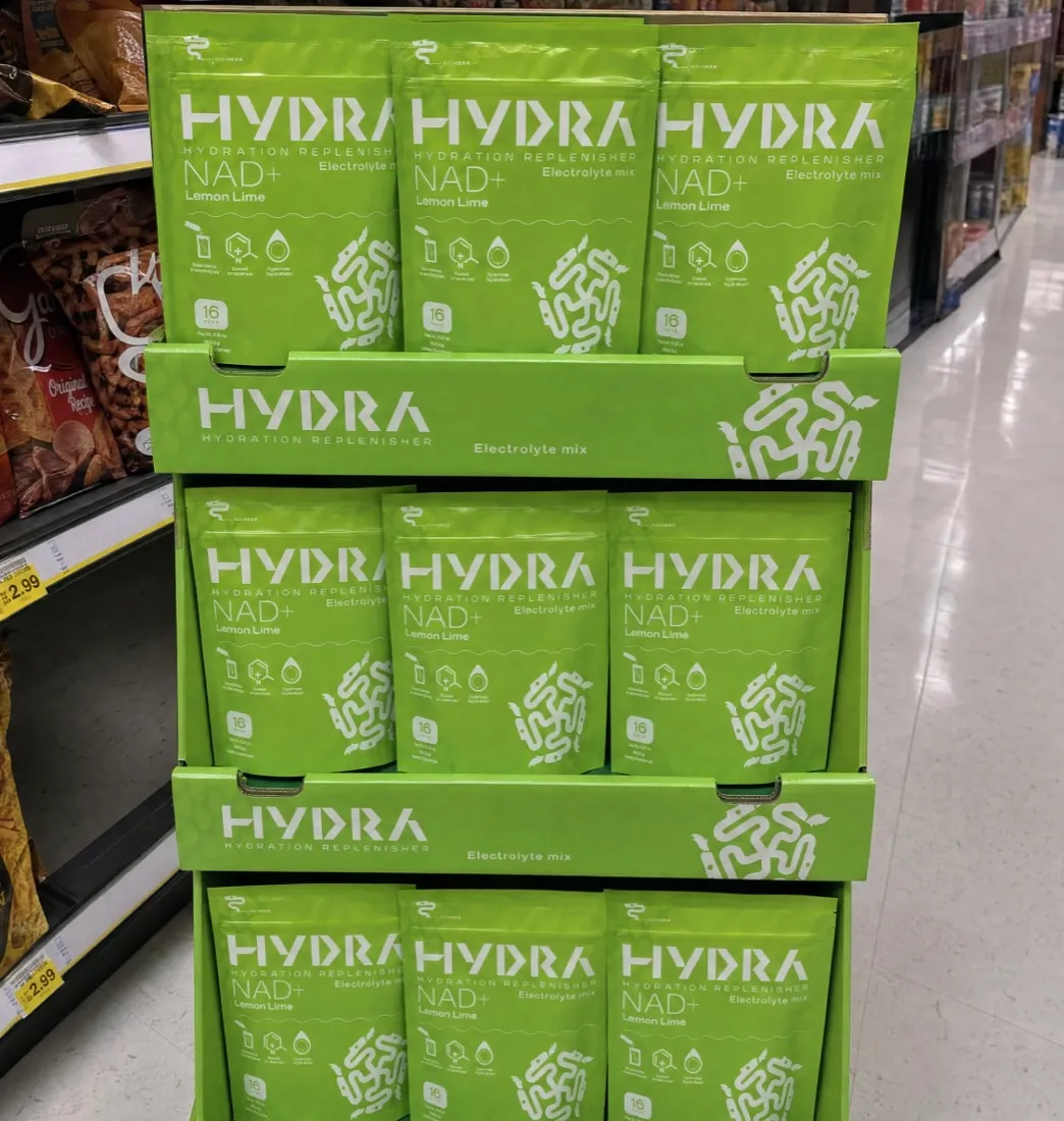Hydra Powders NAD+ electrolyte mix stocked on a retail shelf display.